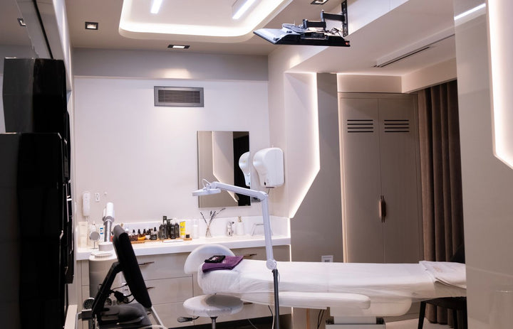 Sleek contemporary med spa treatment room layout