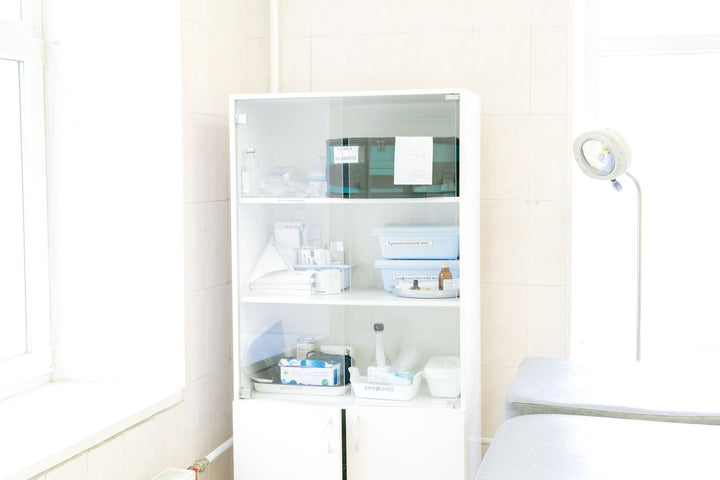 Medical casework cabinet with instruments in an exam room