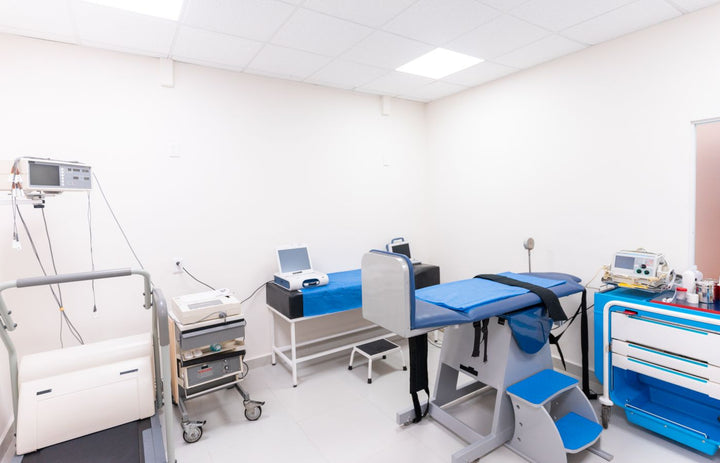 Medical exam room with an examination table and equipment