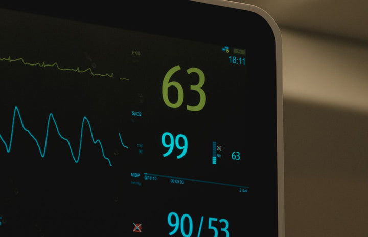 Medical patient monitor displaying heart rate and vital signs