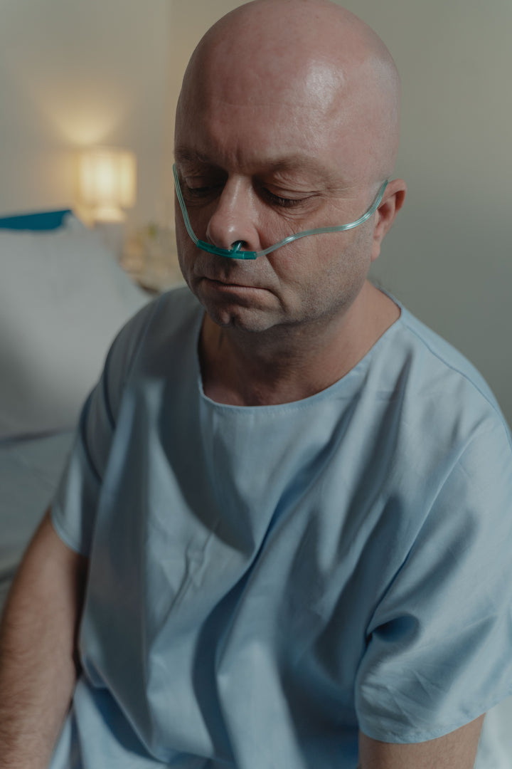 Patient receiving oxygen through a nasal cannula