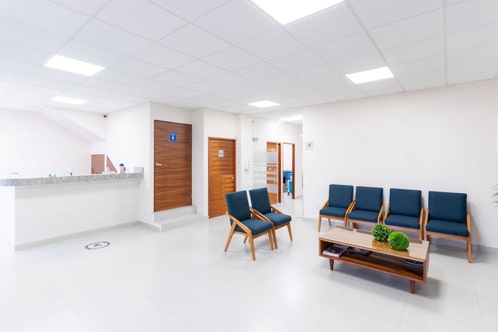 Bright modern medical office waiting room with seating