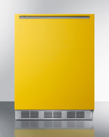 Undercounter 24" refrigerator-freezer for residential use with saffron gold door, stainless steel handle, and black cabi