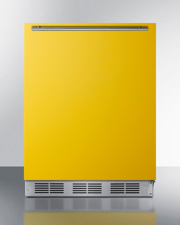Undercounter 24" refrigerator-freezer for residential use with saffron gold door, stainless steel handle, and black cabi