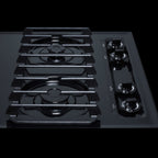 30" wide cooktop with four sealed burners, black porcelain finish, and cast iron grates; made in the USA - Detail