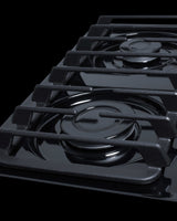 30" wide cooktop with four sealed burners, black porcelain finish, and cast iron grates; made in the USA - Detail